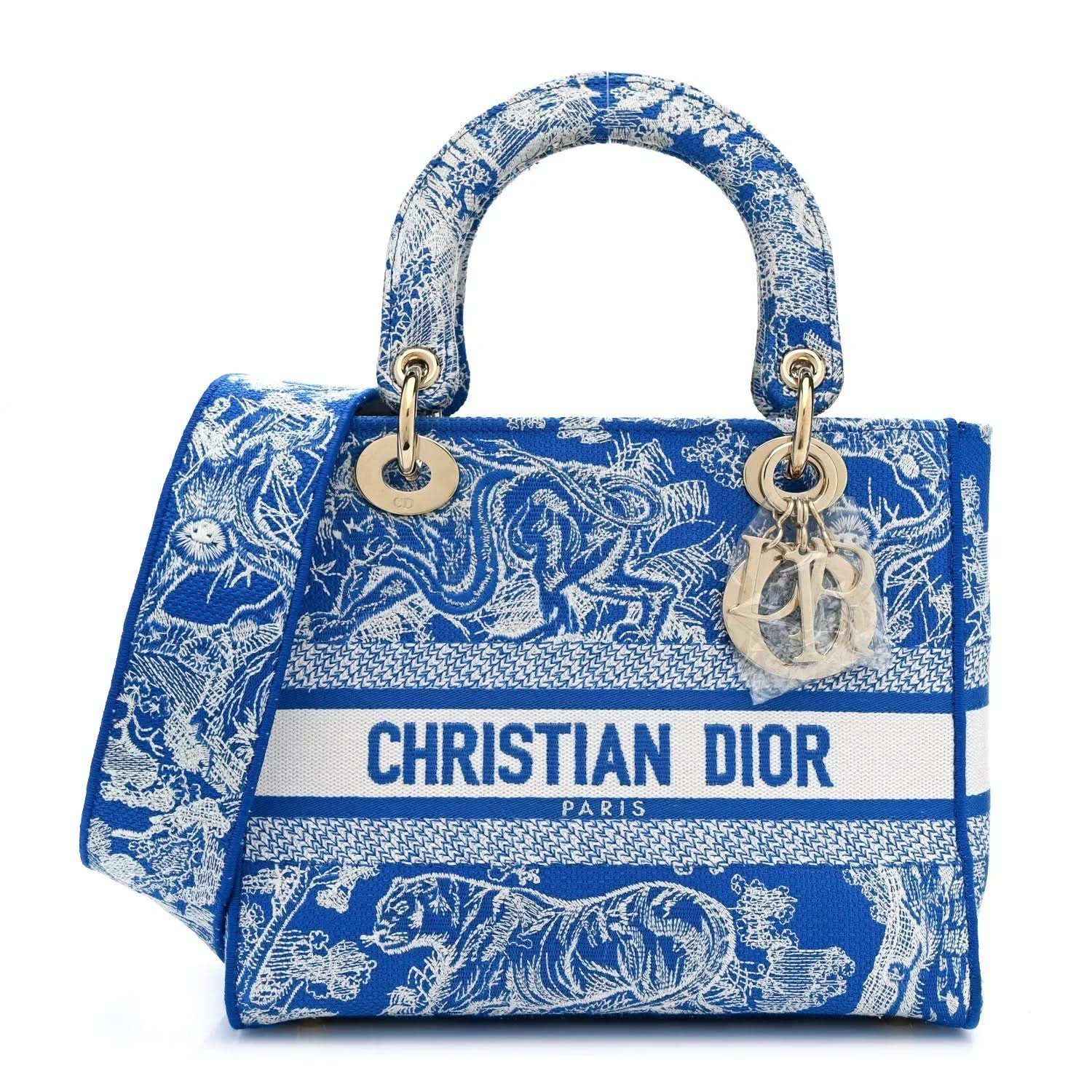 Dior tote bag in bright blue Toile de Jouy print with top handles and logo strip
