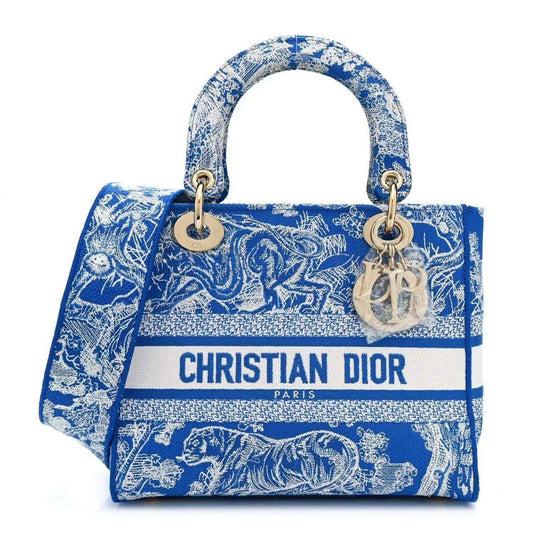 Dior tote bag in bright blue Toile de Jouy print with top handles and logo strip