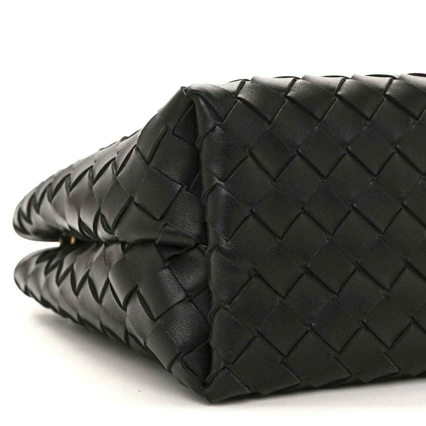 Black woven leather bag corner with chain strap detail and braided edging