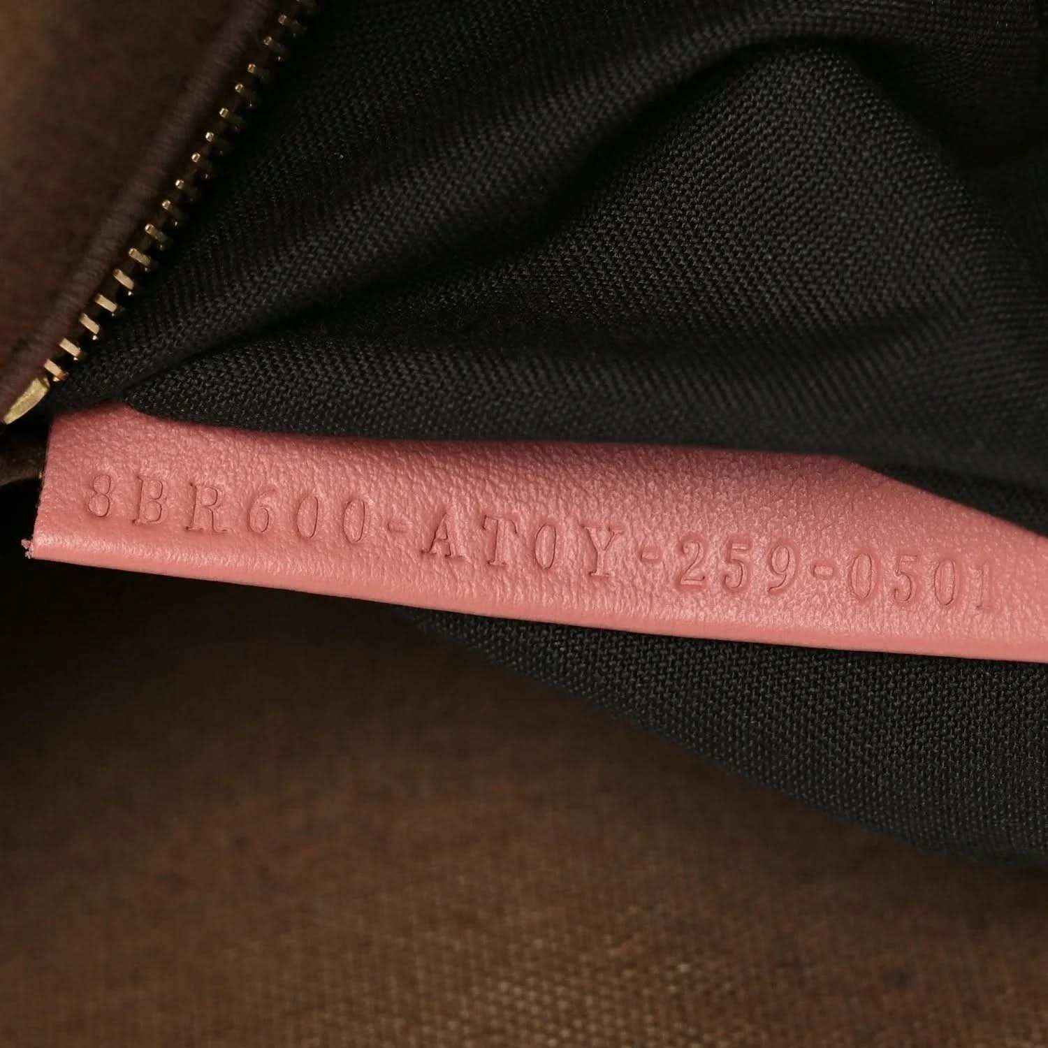Pink velvet baguette bag interior leather trim with embossed serial text
