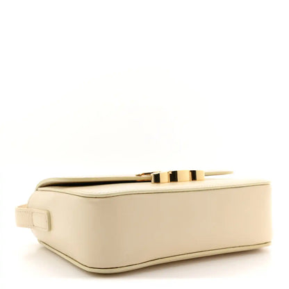 Nude calfskin mini shoulder bag with gold top clasp and structured base