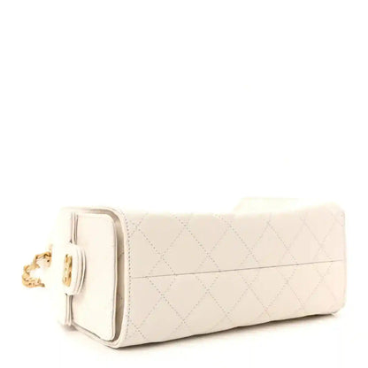 White quilted leather mini handbag with gold-tone side clasp and chain strap