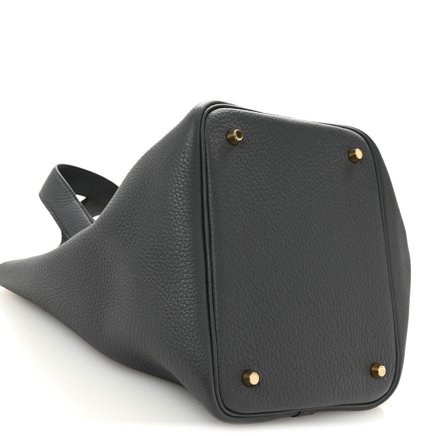 Dark gray leather handbag with gold-toned studs on front panel and angled base