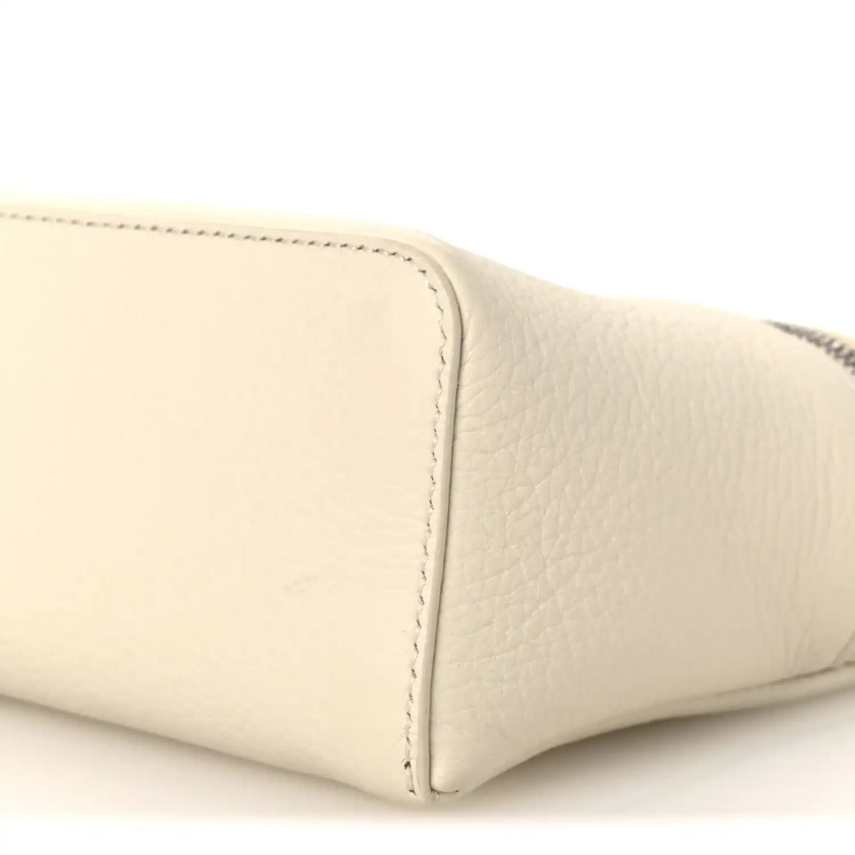 White grained calfskin pouch corner detail with topstitching, close-up