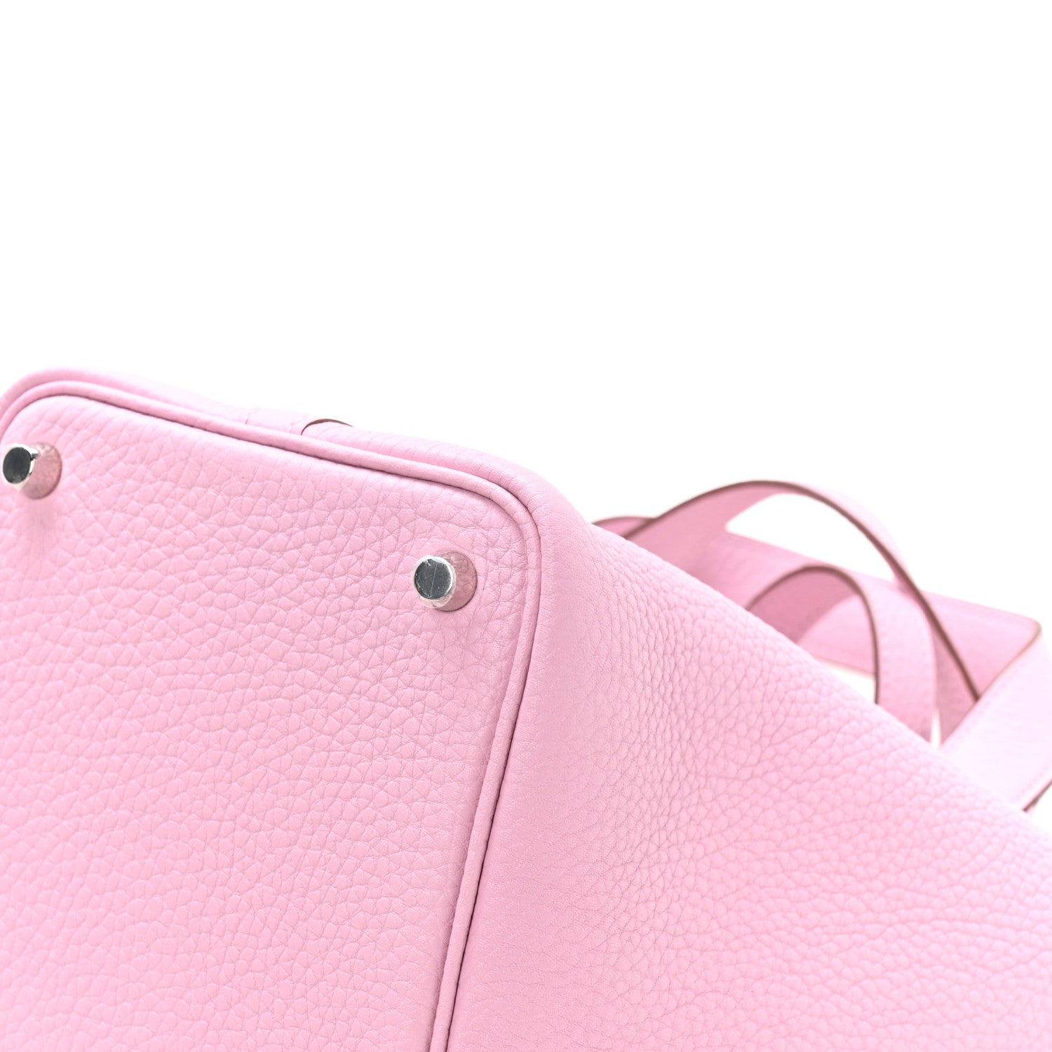 Rose pink textured leather handbag corner with metal stud and short handles