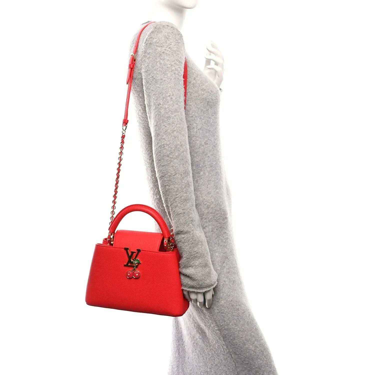 Red mini handbag with chain strap, LV cherry charm, and top handle detail.