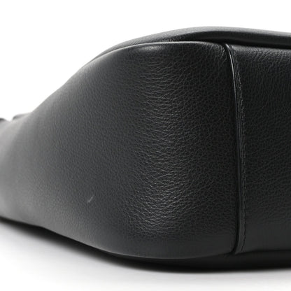Black smooth calfskin hobo bag close-up of front panel and side seam