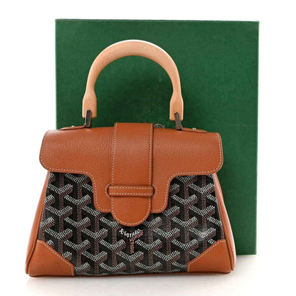 Mini Saigon shoulder bag with top handles, tan leather trim and dark patterned canvas