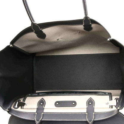 Goyard tote open top edge with leather trim, snap bar, and patterned canvas details