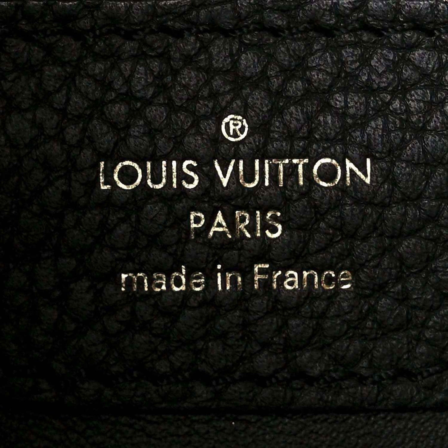 Louis Vuitton leather stamp: “LOUIS VUITTON PARIS” “made in France”
