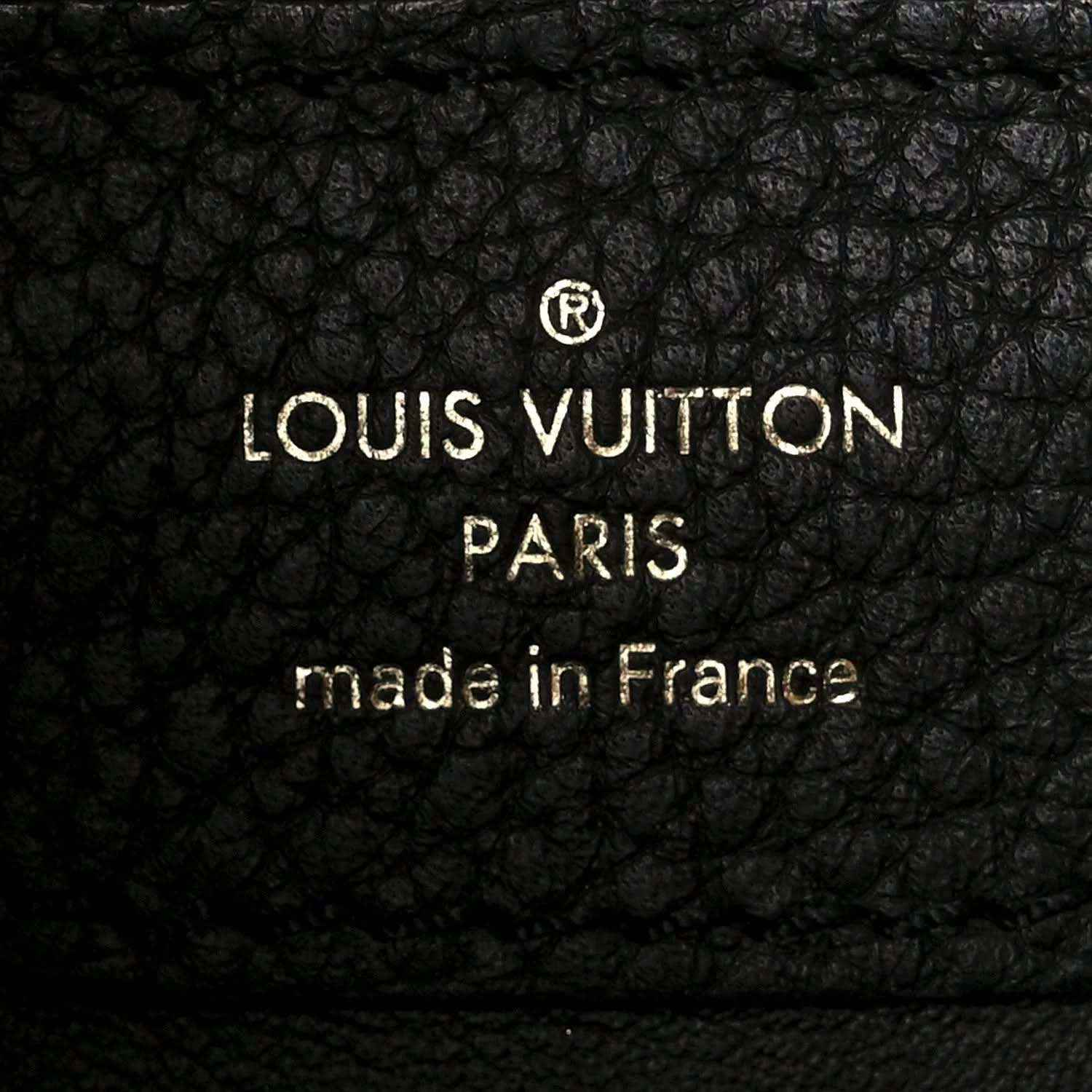 Louis Vuitton leather stamp: “LOUIS VUITTON PARIS” “made in France”