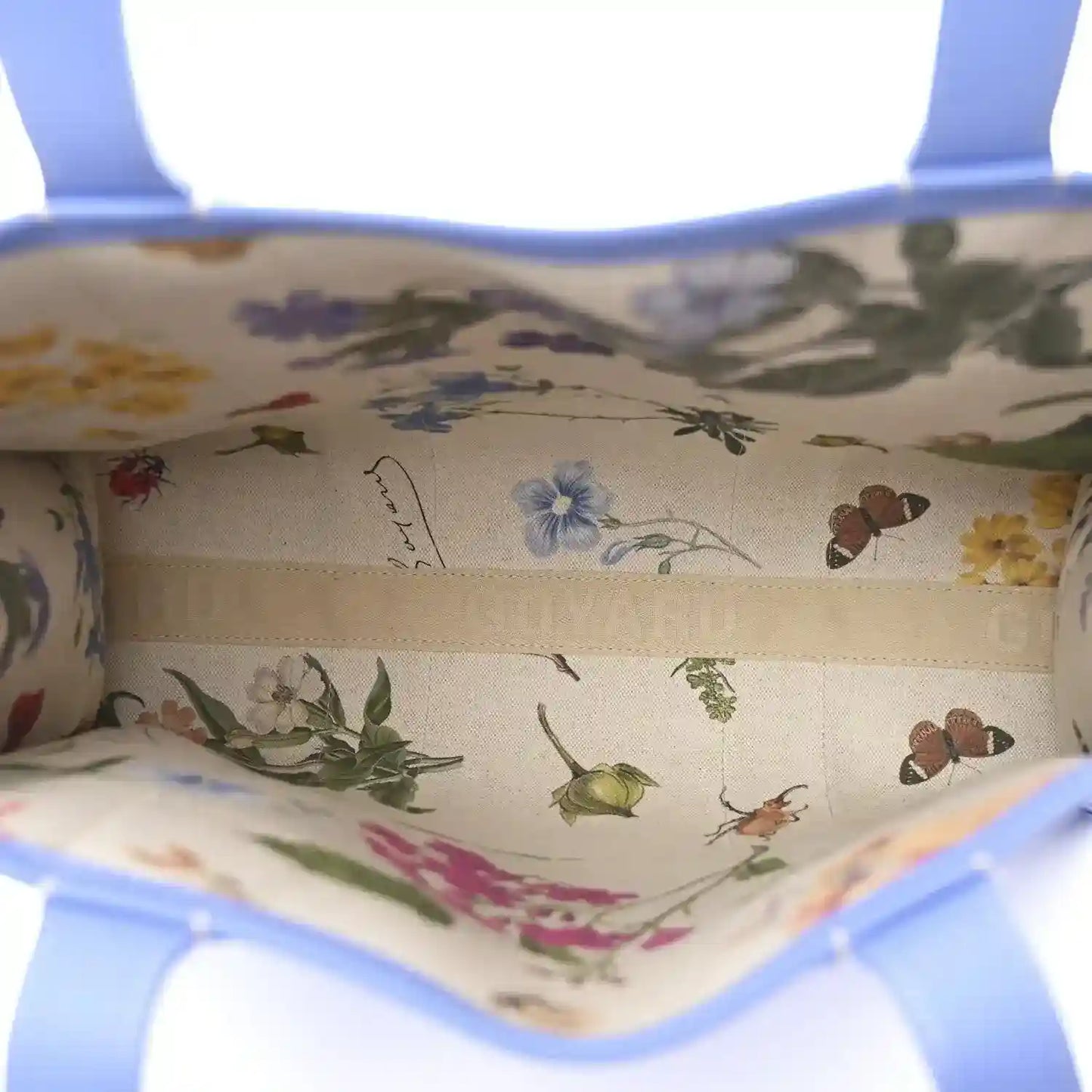 Goyardine Villette PM tote bag interior fabric with floral and butterfly print