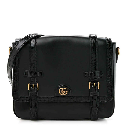 Black leather medium messenger bag with front double buckles and gold Gucci emblem