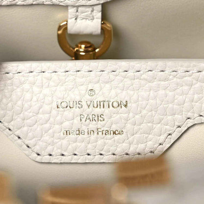 Louis Vuitton Capucines BB leather handbag interior with "Louis Vuitton Paris" label