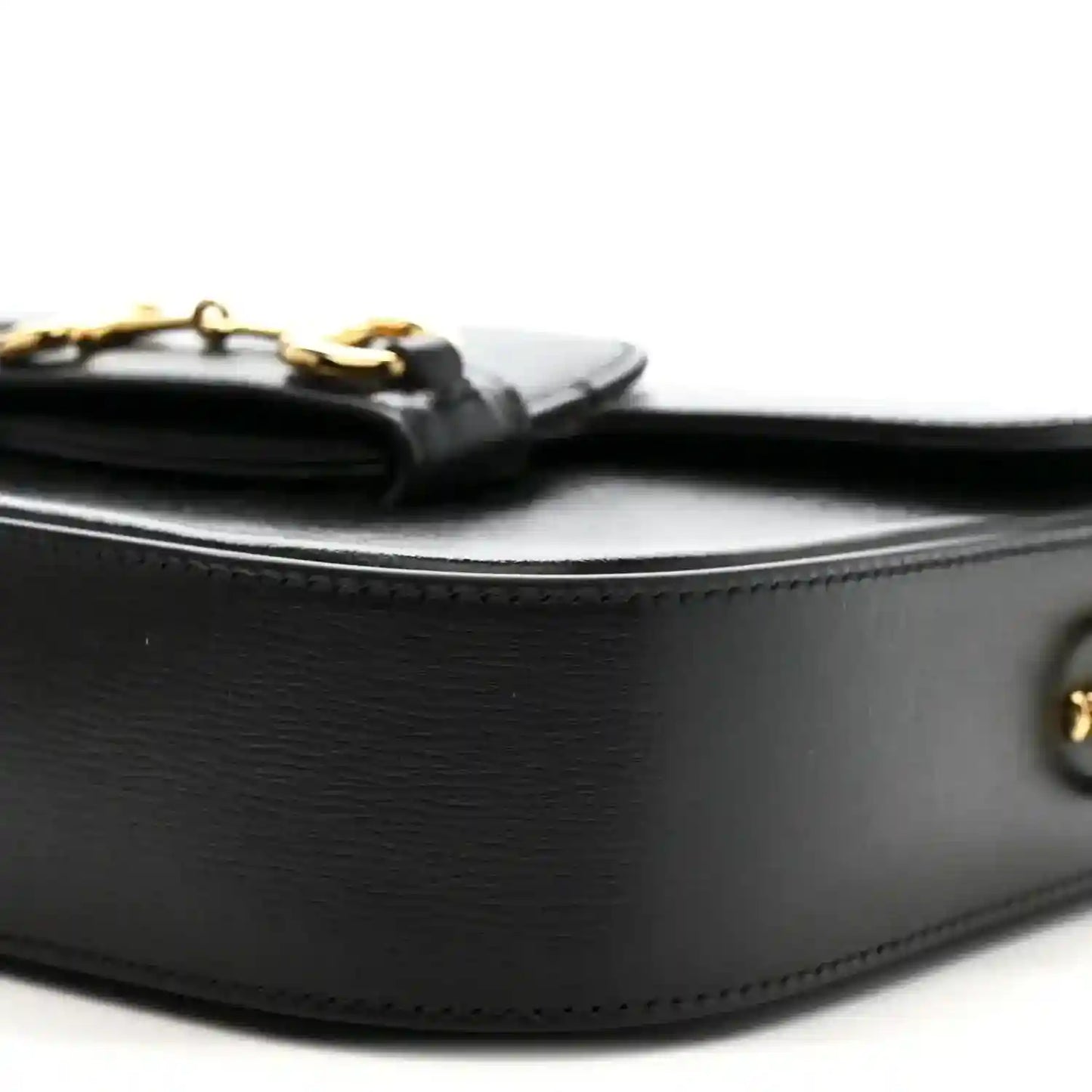 Black calfskin mini shoulder bag, curved flap edge with gold hardware details