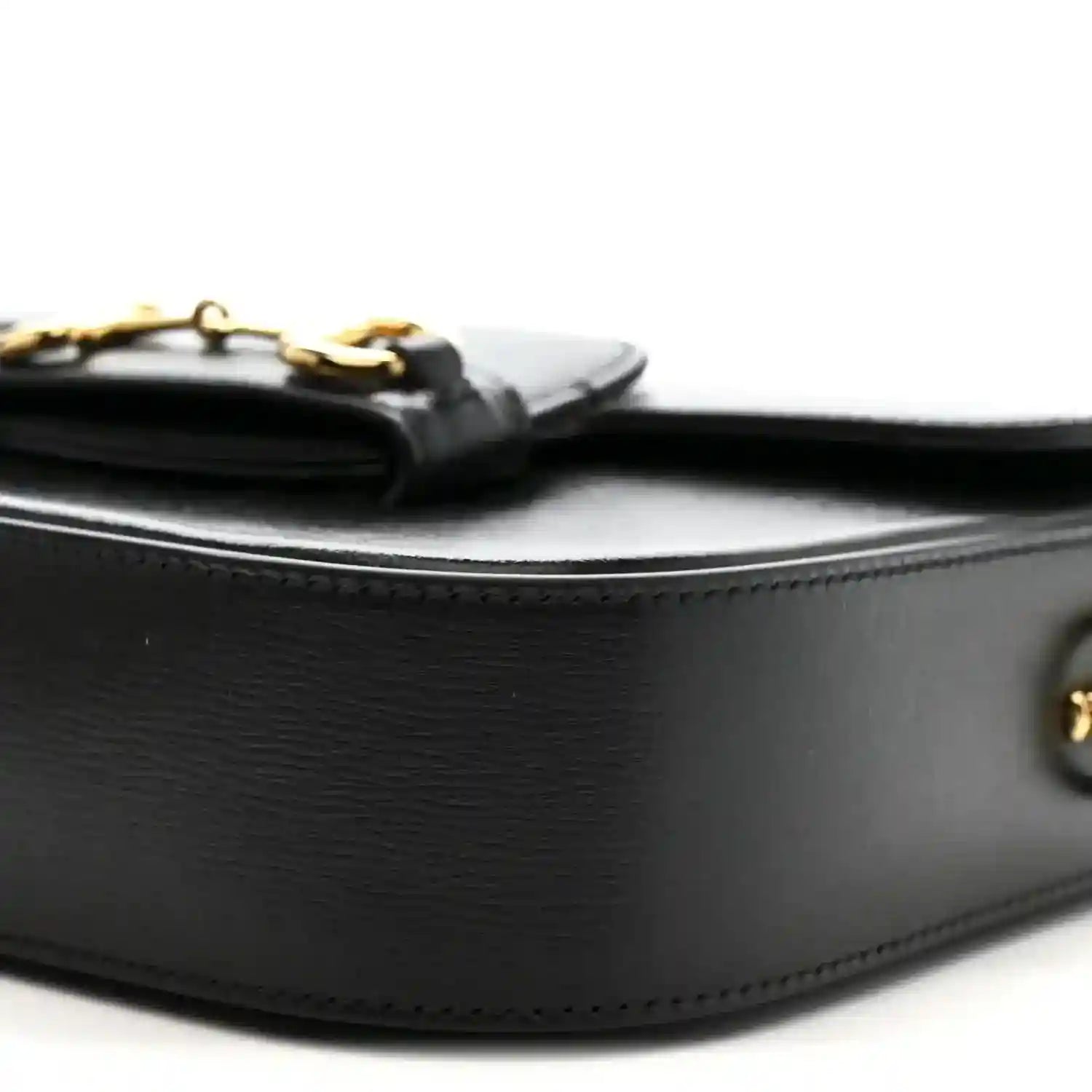 Black calfskin mini shoulder bag, curved flap edge with gold hardware details