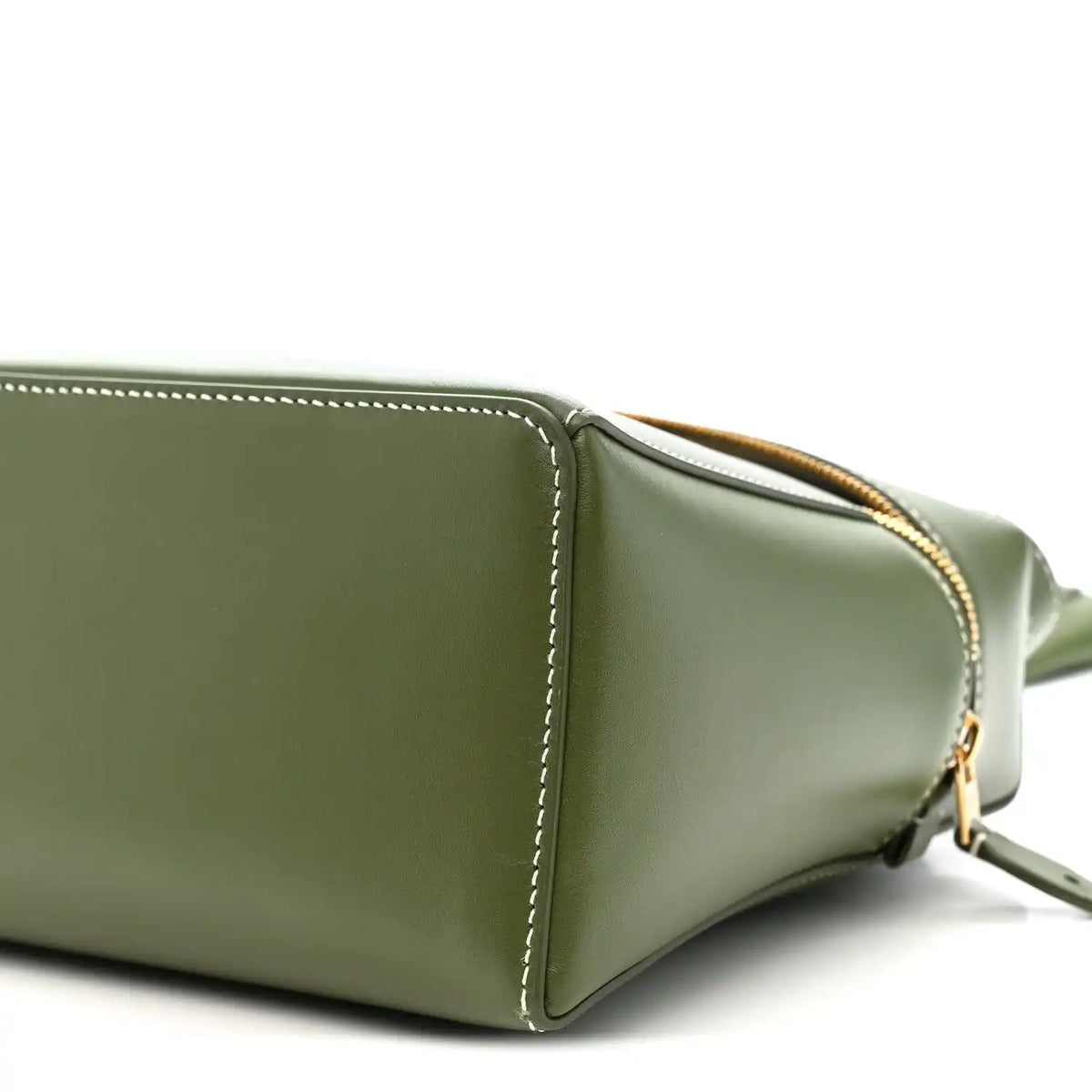 Olive green leather handbag corner detail with gold zipper trim and strap hardware