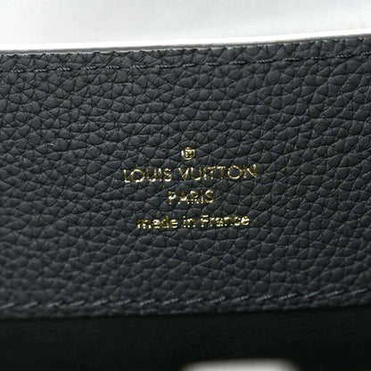 Matte black pebbled leather handbag with Louis Vuitton gold logo patch