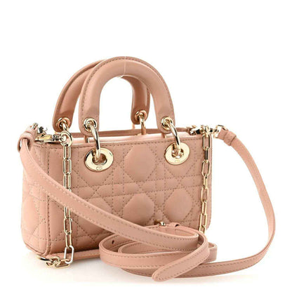 Christian Dior micro handbag with pink beige quilted cannage, top handles, and shoulder strap