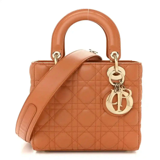 Small Lady Dior tote in orange quilted lambskin with top handles and gold hardware