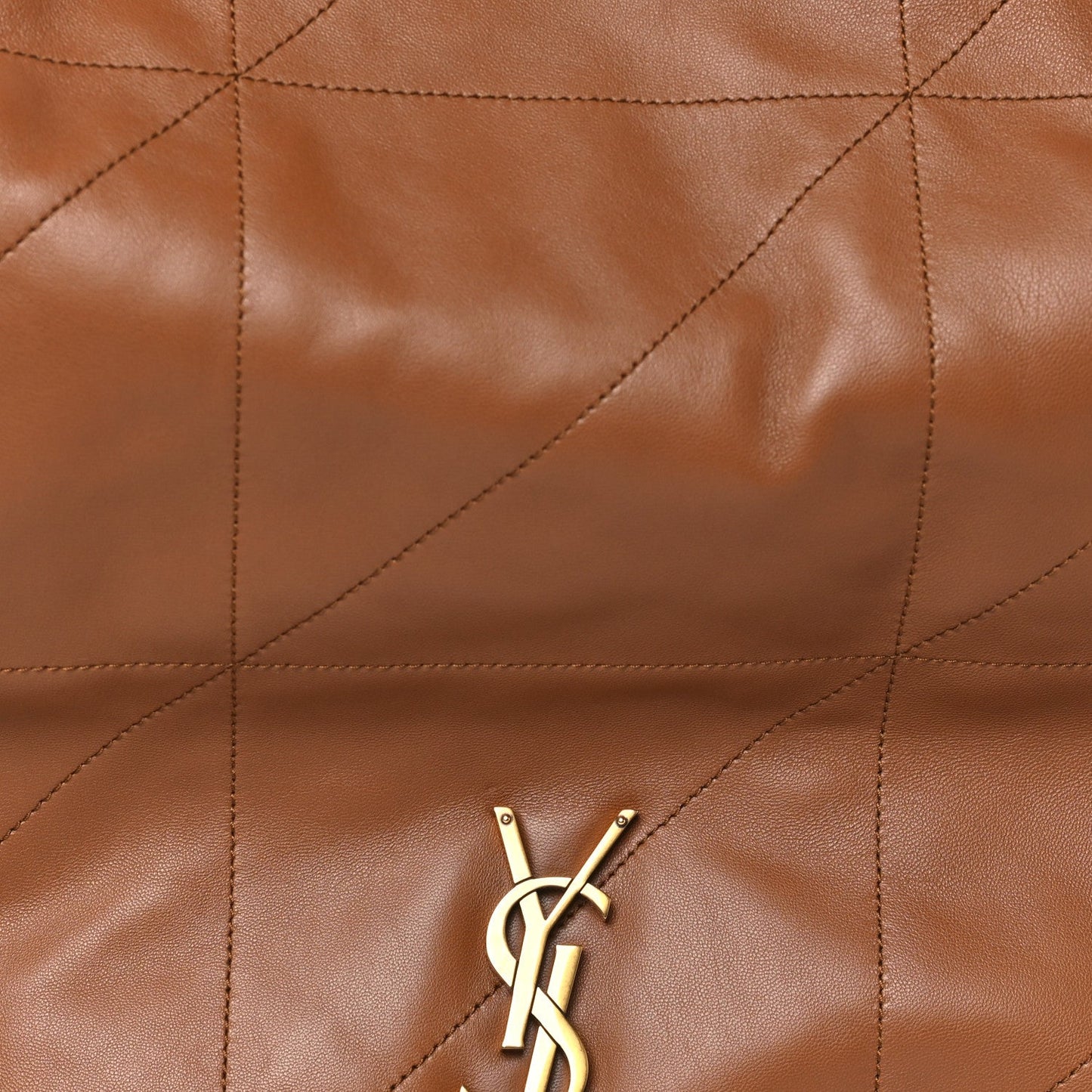 Quilted lambskin leather panel with gold YSL monogram on front