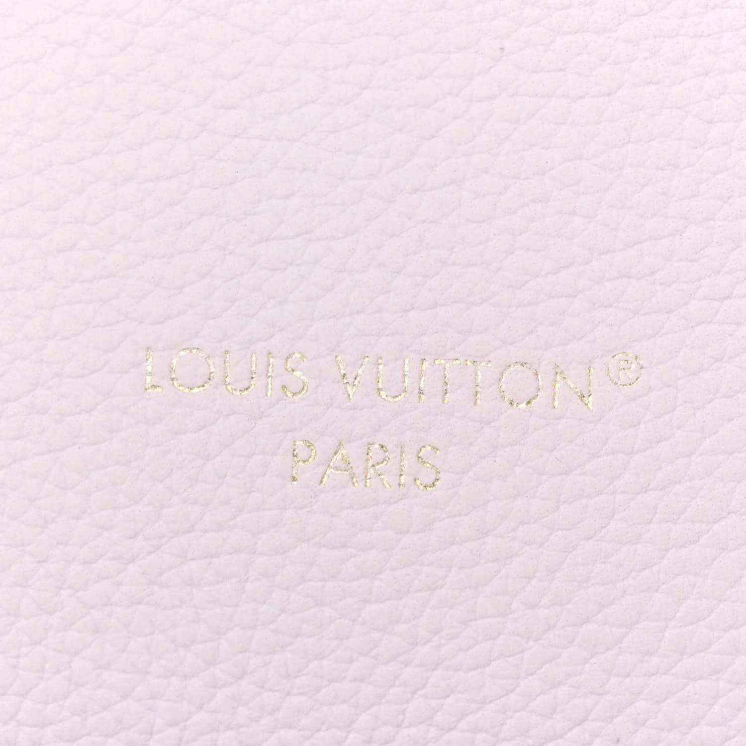 Embossed “Louis Vuitton Paris” on pale lilac leather surface