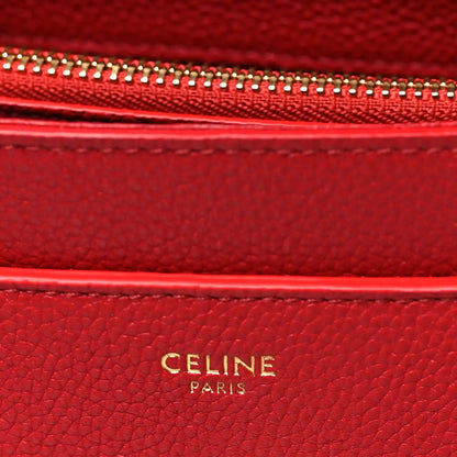 Celine red leather interior label with gold 'CELINE PARIS' embossing.