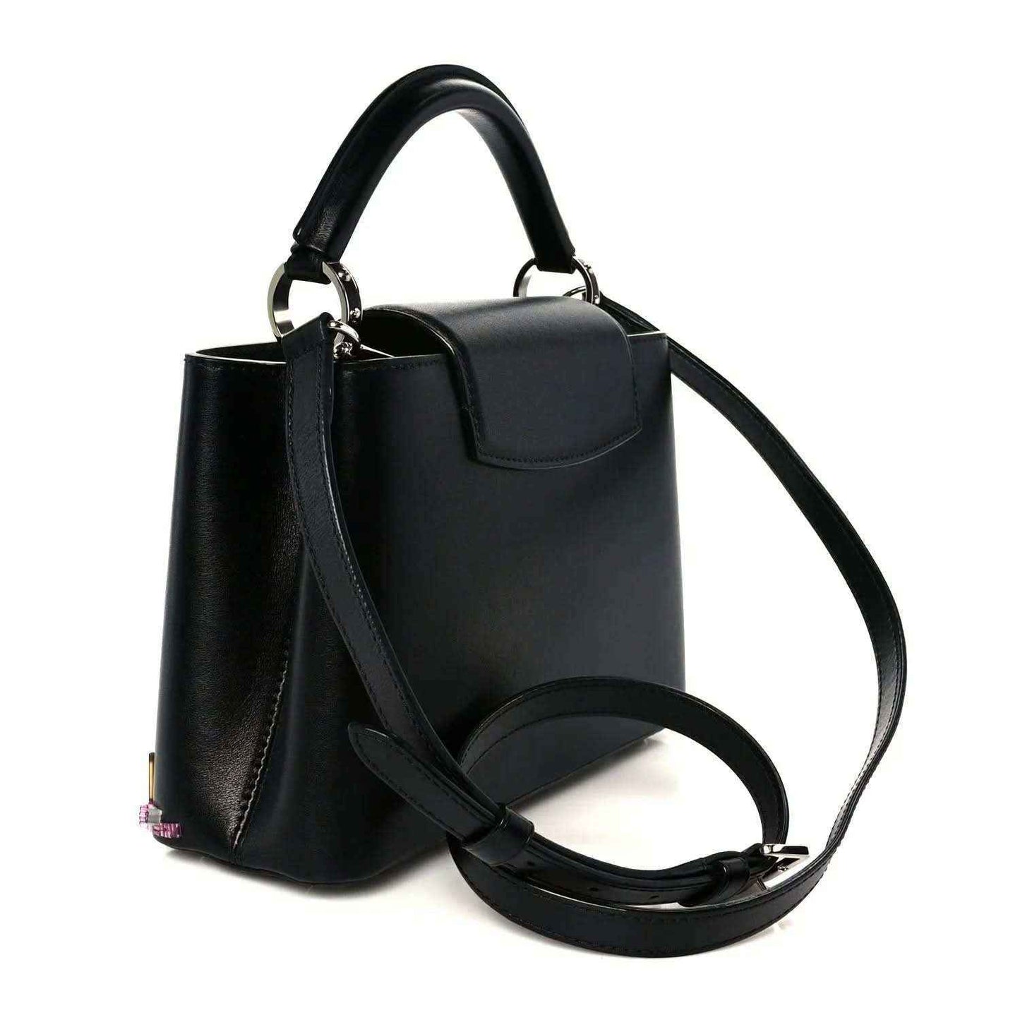 Capucines BB black calfskin bag with top handle, flap, and long shoulder strap