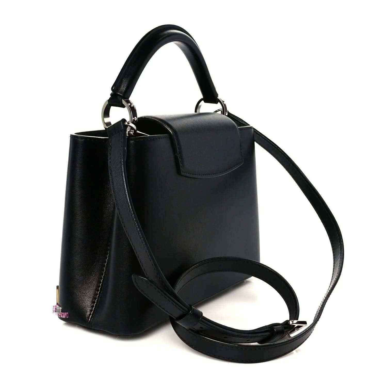 Capucines BB black calfskin bag with top handle, flap, and long shoulder strap