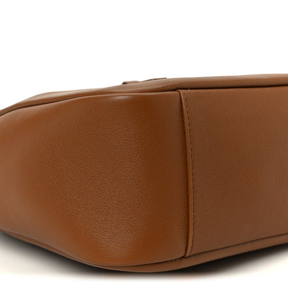Saint Laurent hobo bag close-up of smooth brown leather side with panel seam