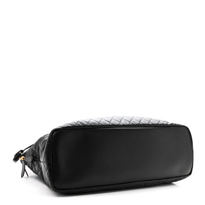 Saint Laurent ES quilted travel bag in black leather, back panel with zipper and strap.