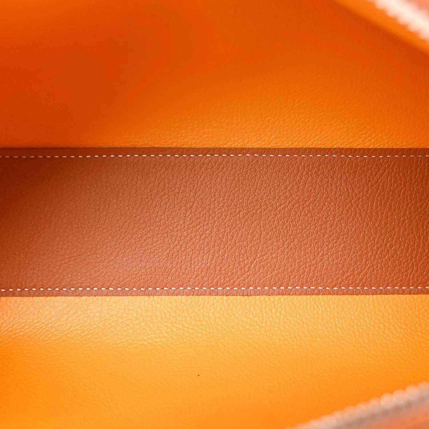 Tan leather panel with visible stitched edge and perforated trim details