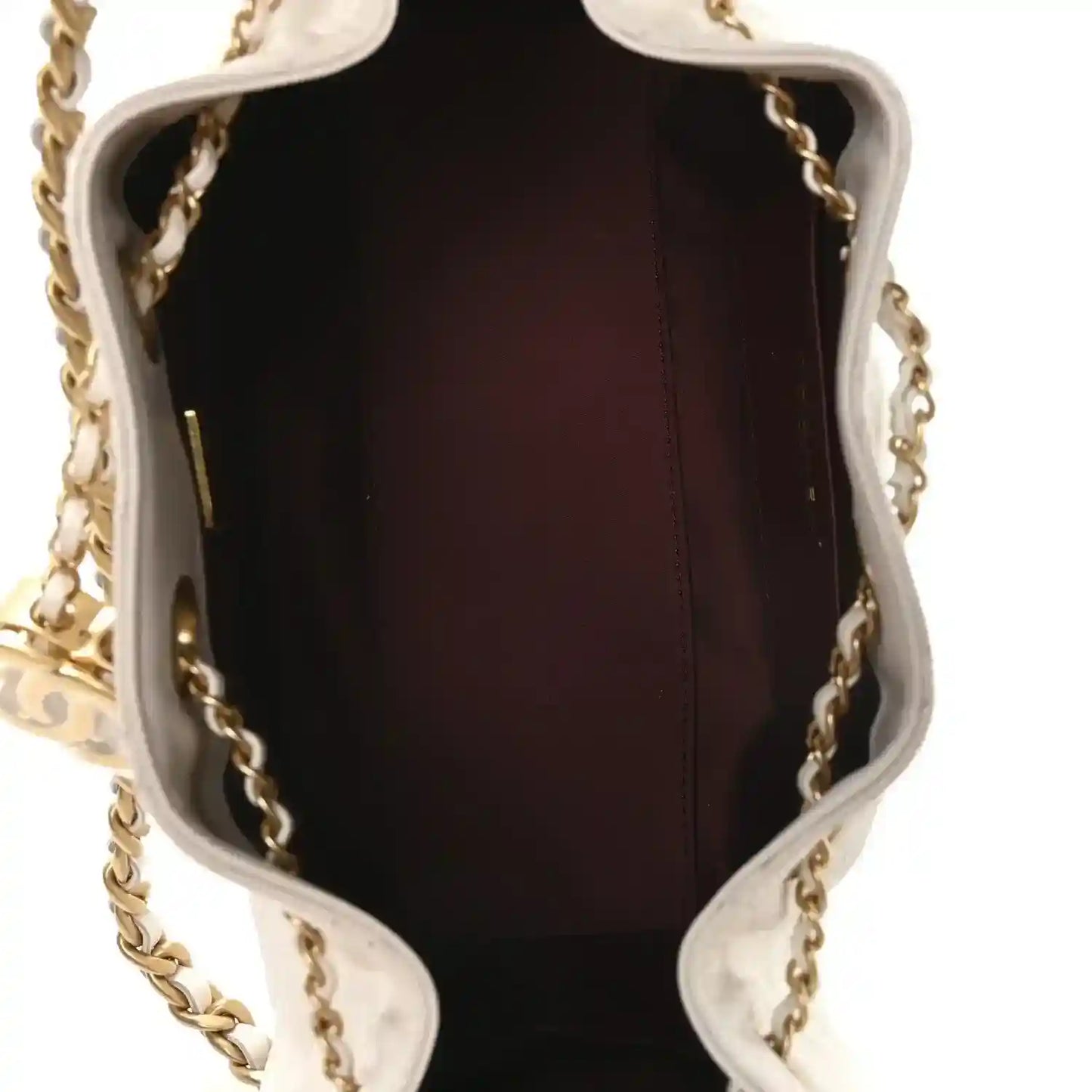 Open mini handbag interior with dark burgundy lining and gold chain hardware.