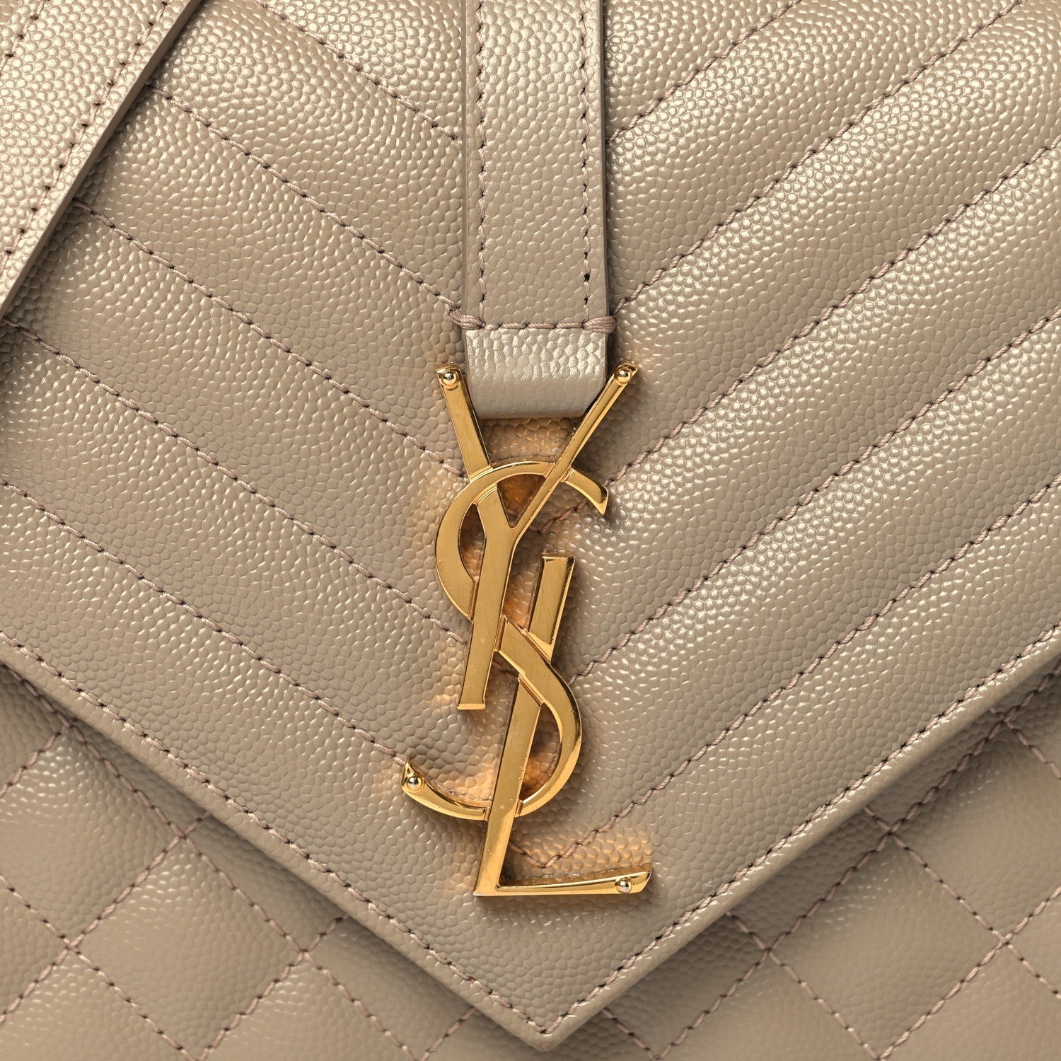 Gold-tone YSL logo on dusty grey quilted satchel front
