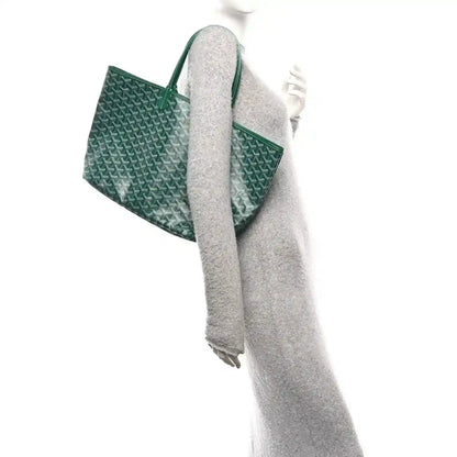 Green canvas tote bag with long strap and structured top