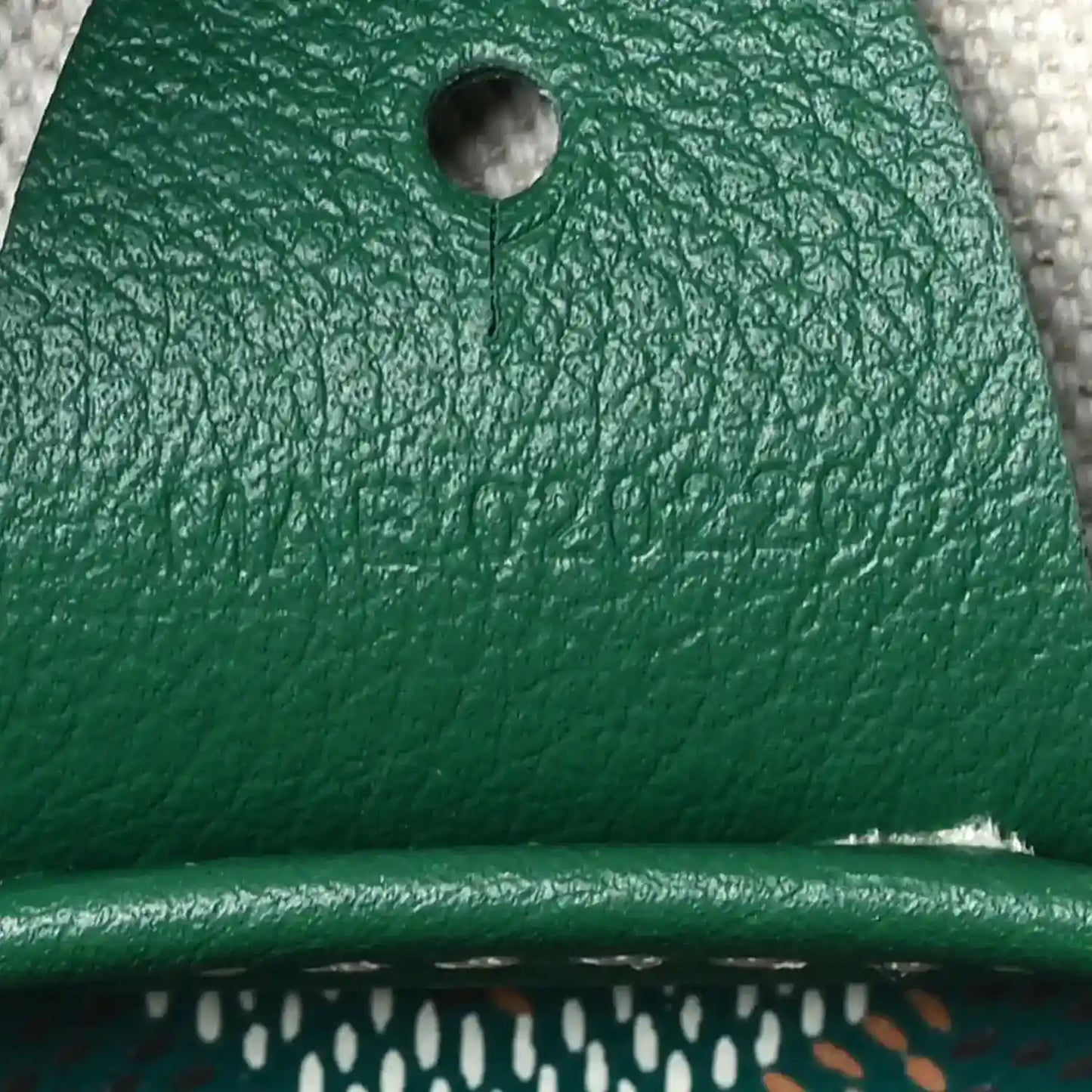 Green Goyardine Artois PM tote bag, leather panel with round grommet and textured grain