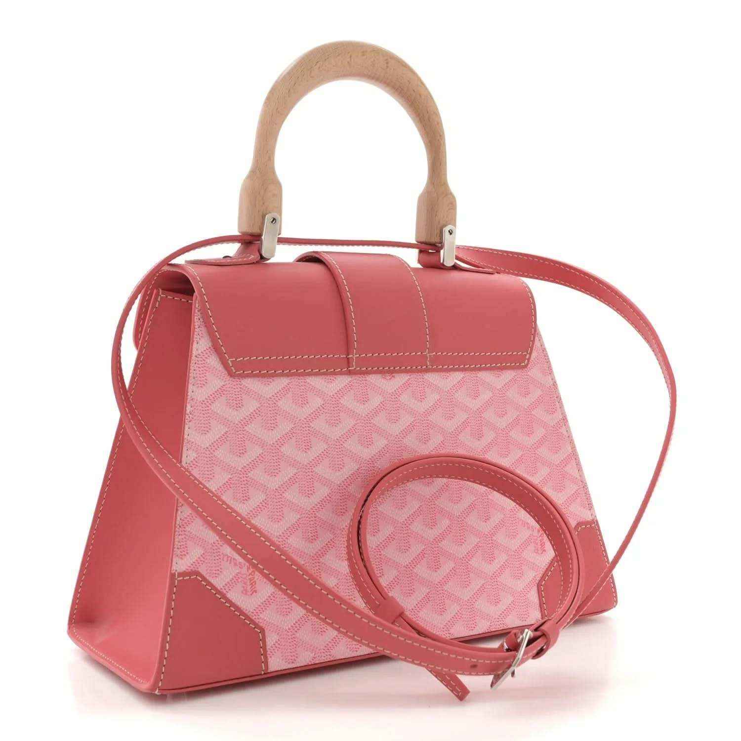 Pink canvas satchel tote with wooden handles, crossbody strap, and repeating logo pattern panel.