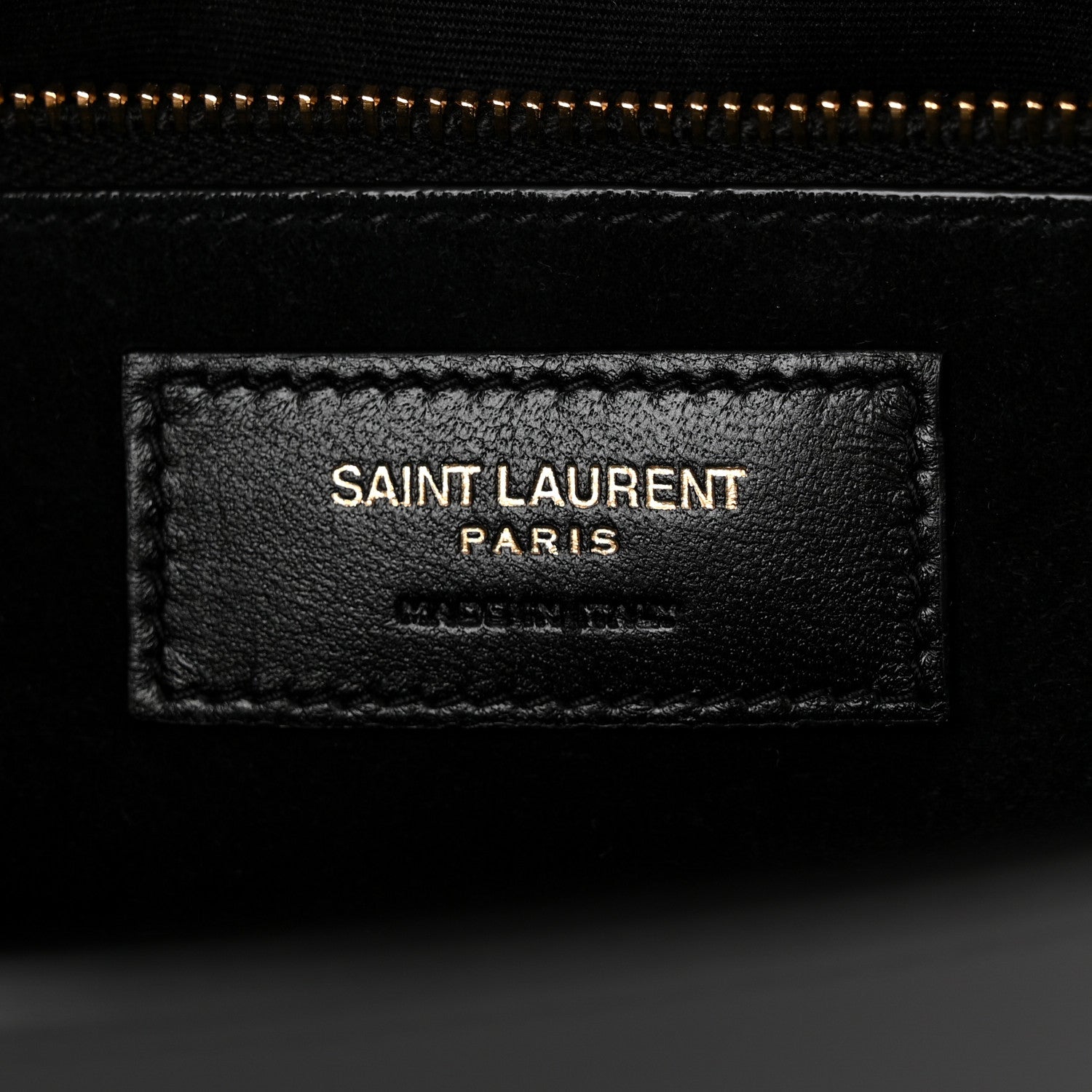Saint Laurent black leather interior label reading "SAINT LAURENT PARIS"