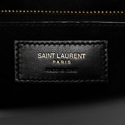 Saint Laurent black leather interior label reading "SAINT LAURENT PARIS"