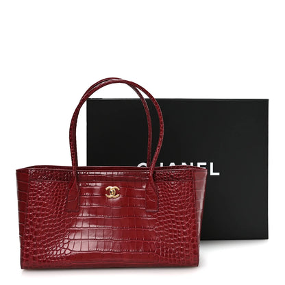 Small Chanel shopping bag with top handles and croc-embossed leather in dark red
