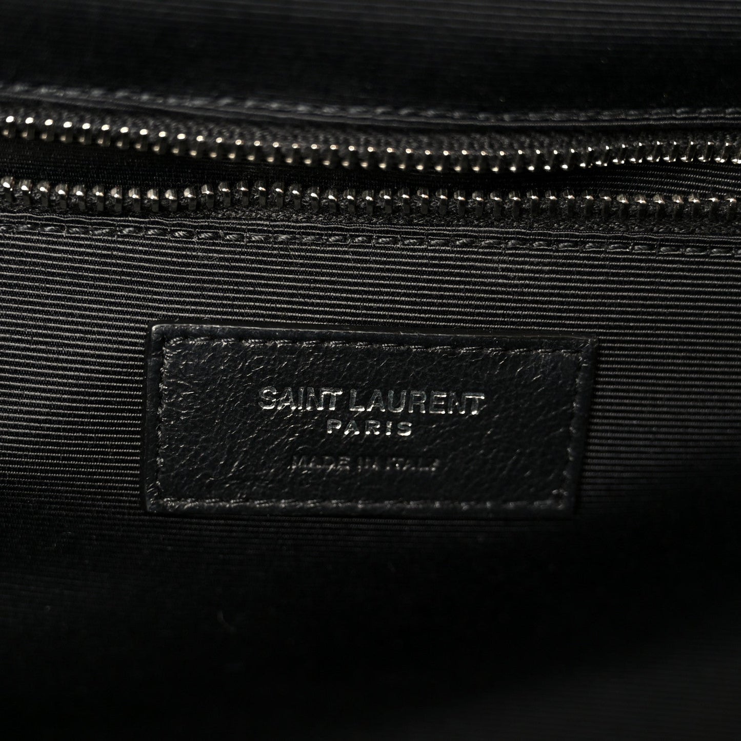 Black fabric lining inside satchel with SAINT LAURENT PARIS label