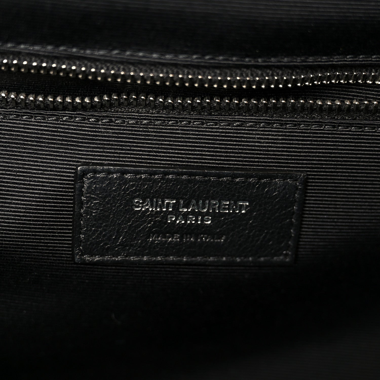 Black fabric lining inside satchel with SAINT LAURENT PARIS label