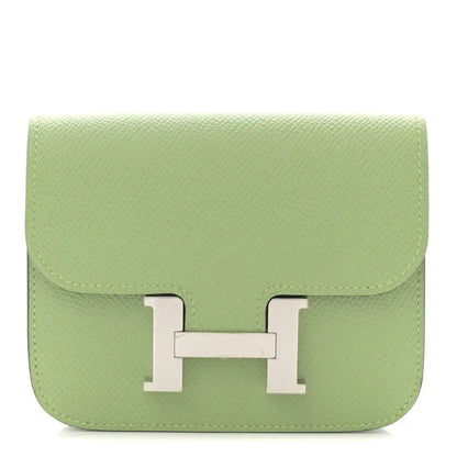 Light green leather slim wallet with front H clasp and top flap