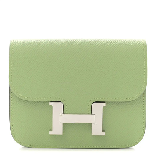 Light green leather slim wallet with front H clasp and top flap