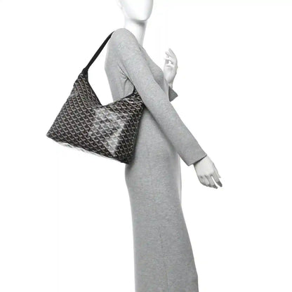 Chevron-pattern hobo shoulder bag worn on arm, gray knit-style display