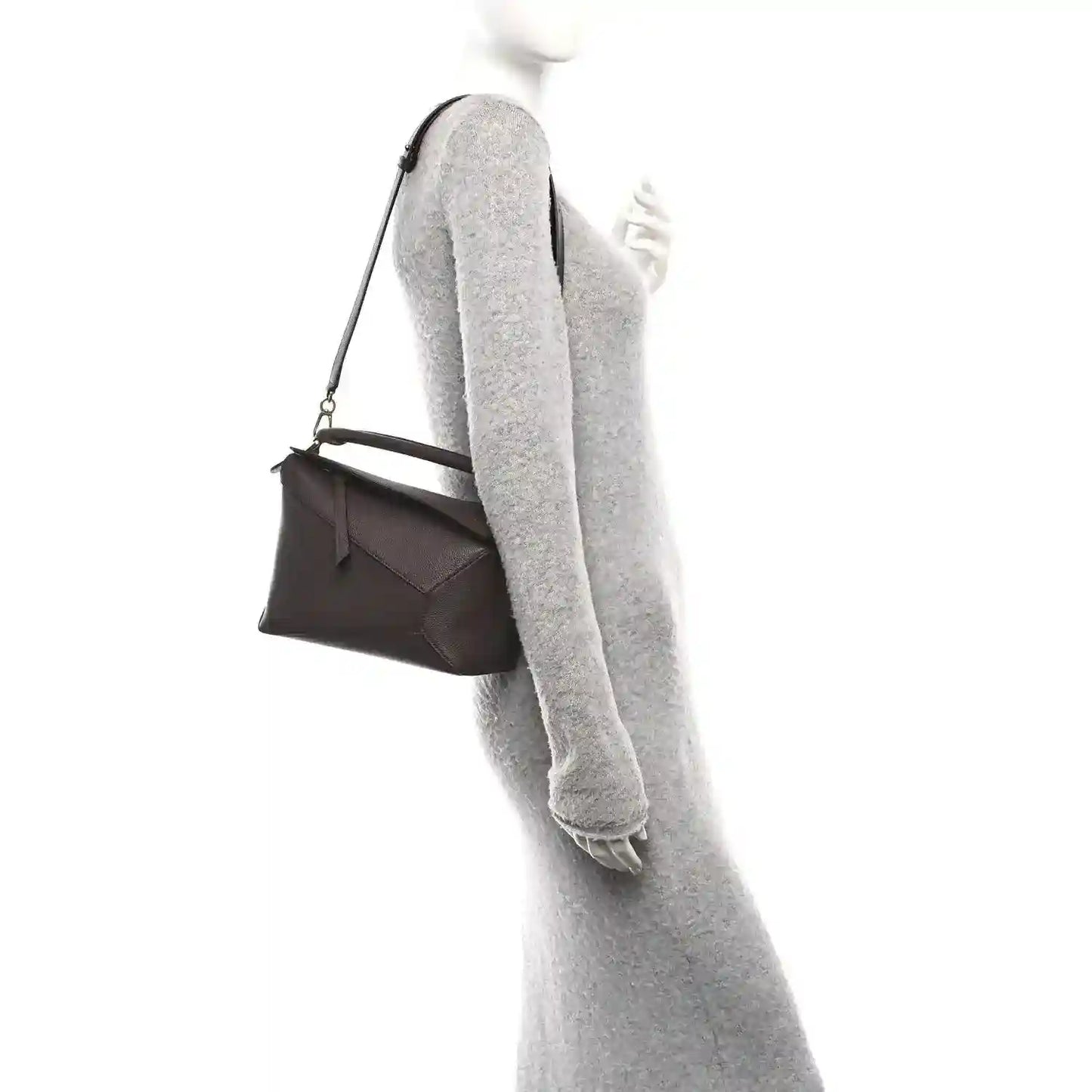 Dark chestnut grained leather small bag worn crossbody with adjustable shoulder strap