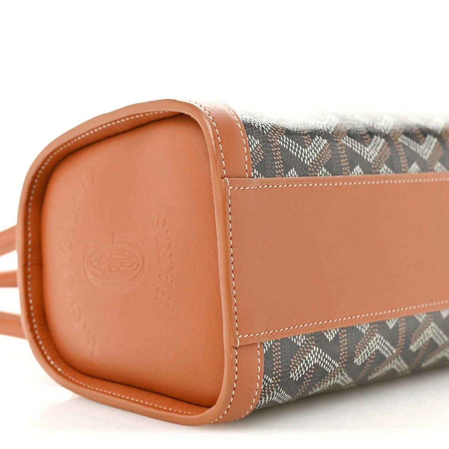 Bonbonnière bag end panel close-up: tan leather corner with smooth grain and stitched border