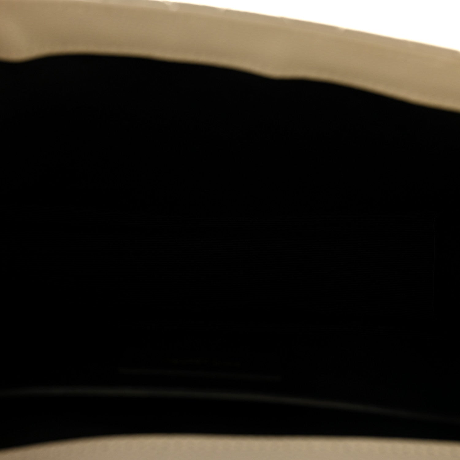 Black leather satchel interior lining close-up