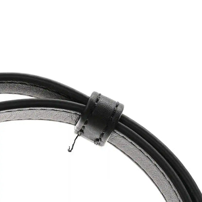 Black leather strap with adjustment loop and metal hardware