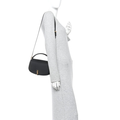 Black YSL logo crossbody bag with long strap and top handle.